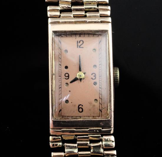 A ladys 14k gold Moeris manual wind wrist watch on an unmarked gold bracelet,
